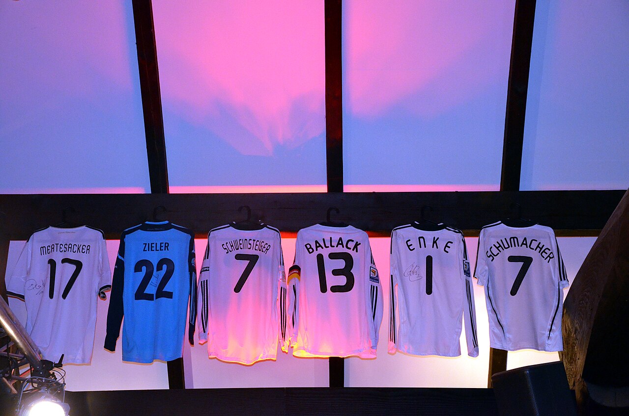 Bastian Schweinsteiger football shirt displayed among hanging player shirts